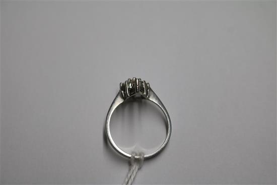 A platinum and lozenge shaped diamond cluster ring, size L/M.